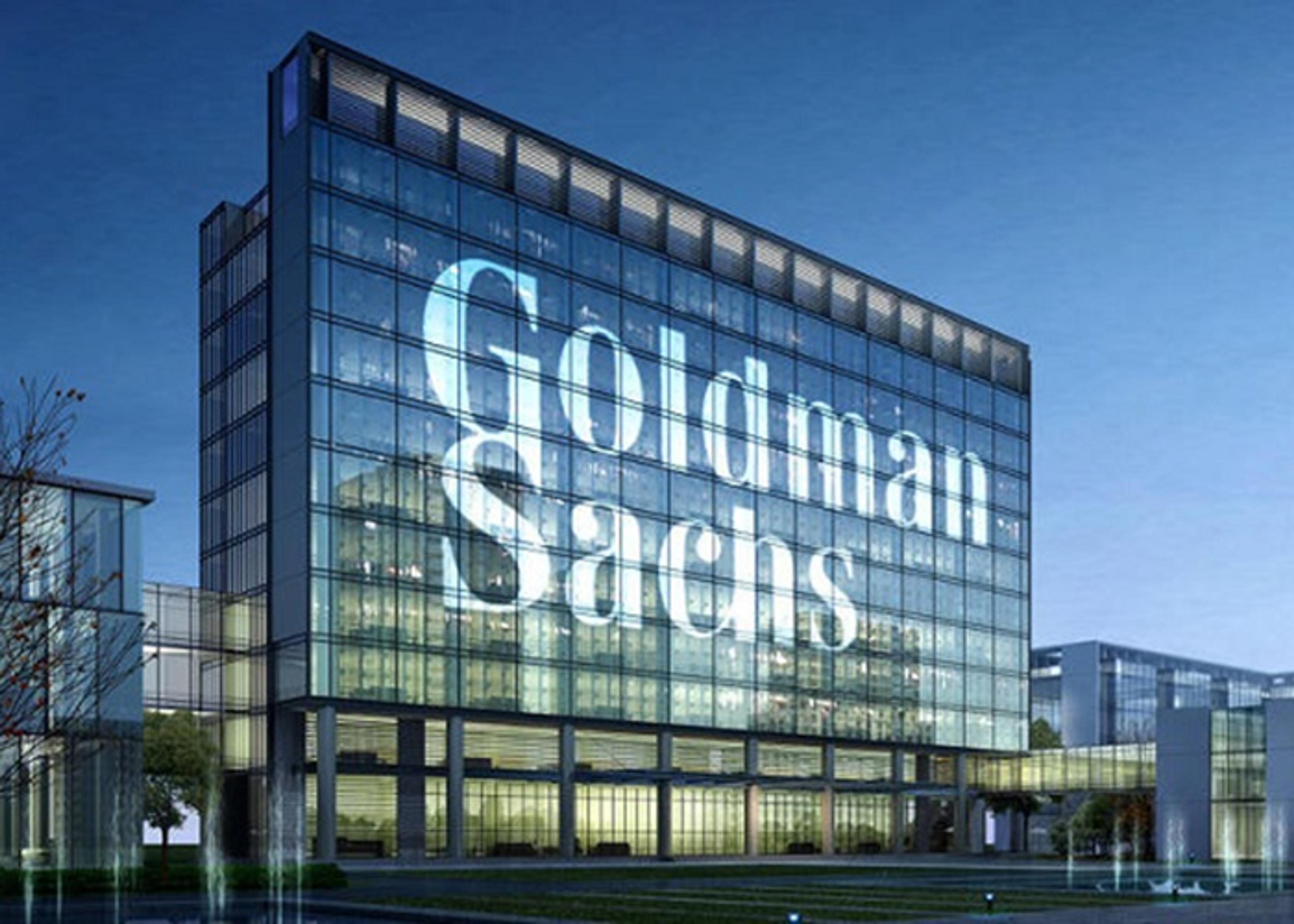 Exterior view of the Goldman Sachs corporate headquarters, featuring the company's name emblazoned across the exterior glass façade.