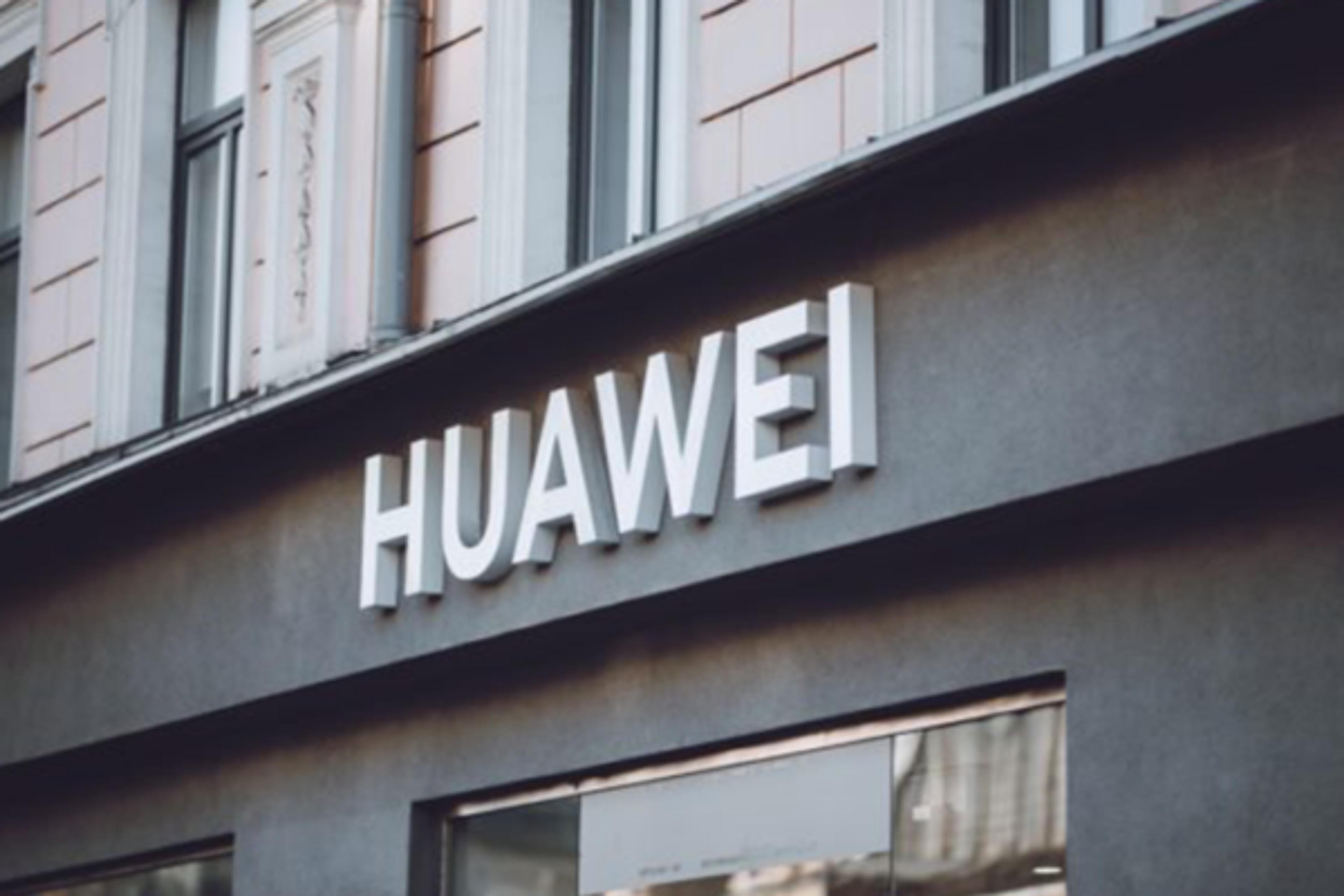 Huawei corporate sign on building façade.