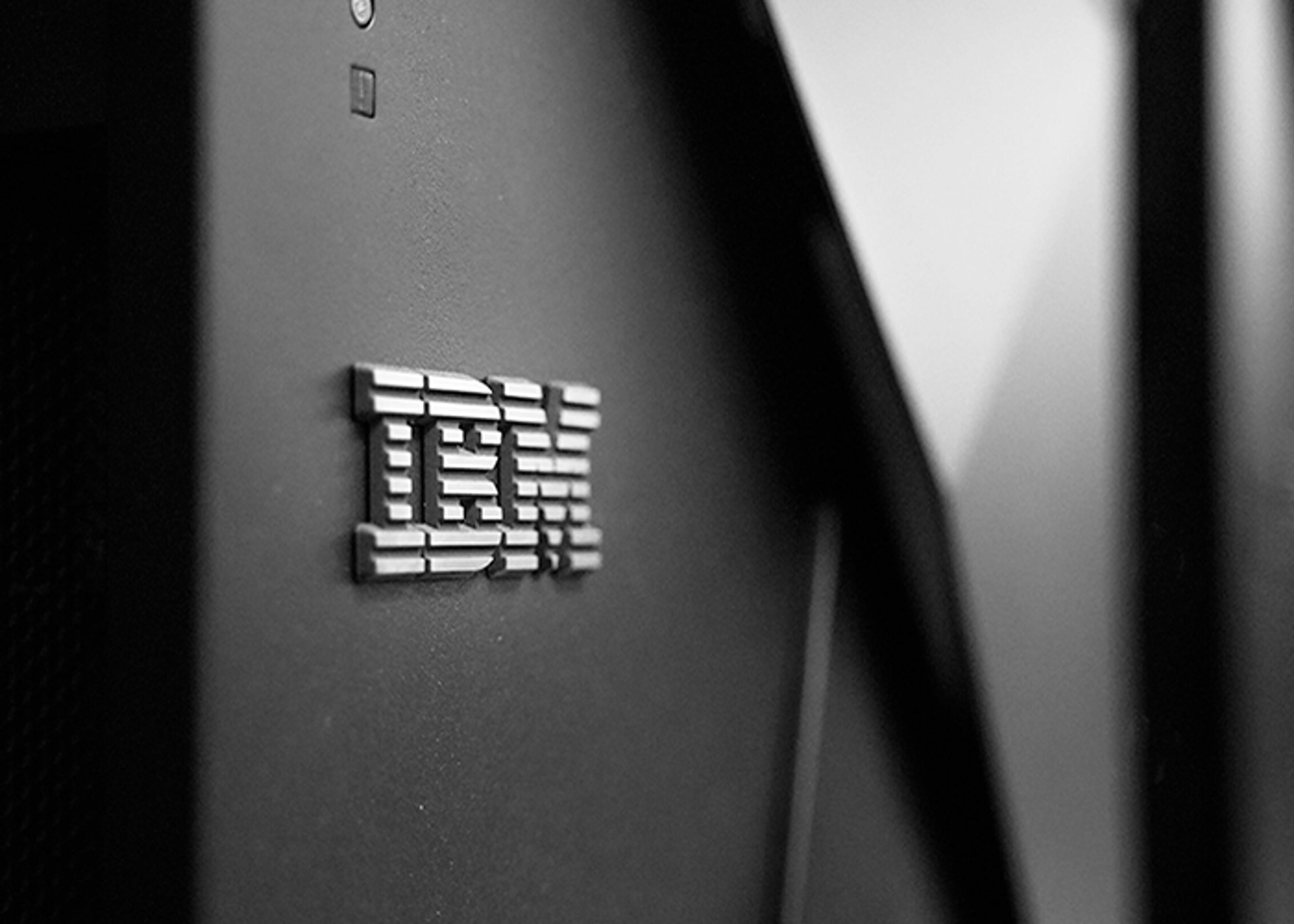 Close-up of the IBM logo on the side of a server in monotone.