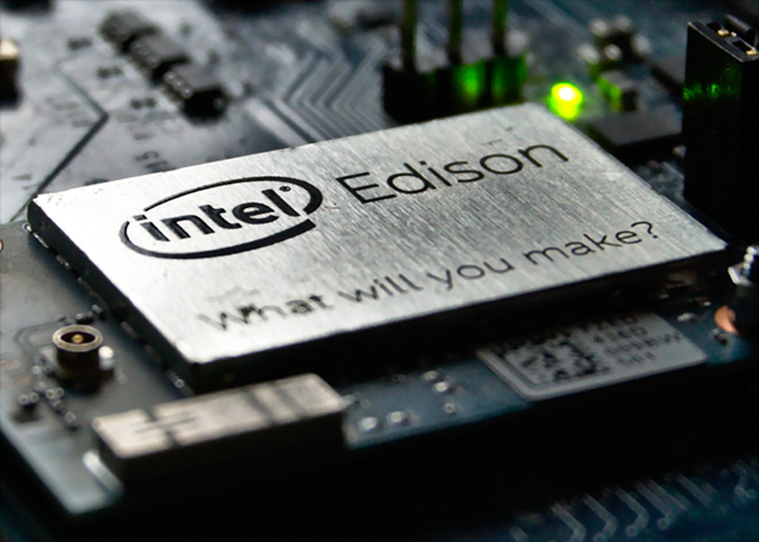 Close-up of an Intel Edison chip on a circuit board, displaying the Intel logo, the word "Edison", and the phrase "What will you make?".
