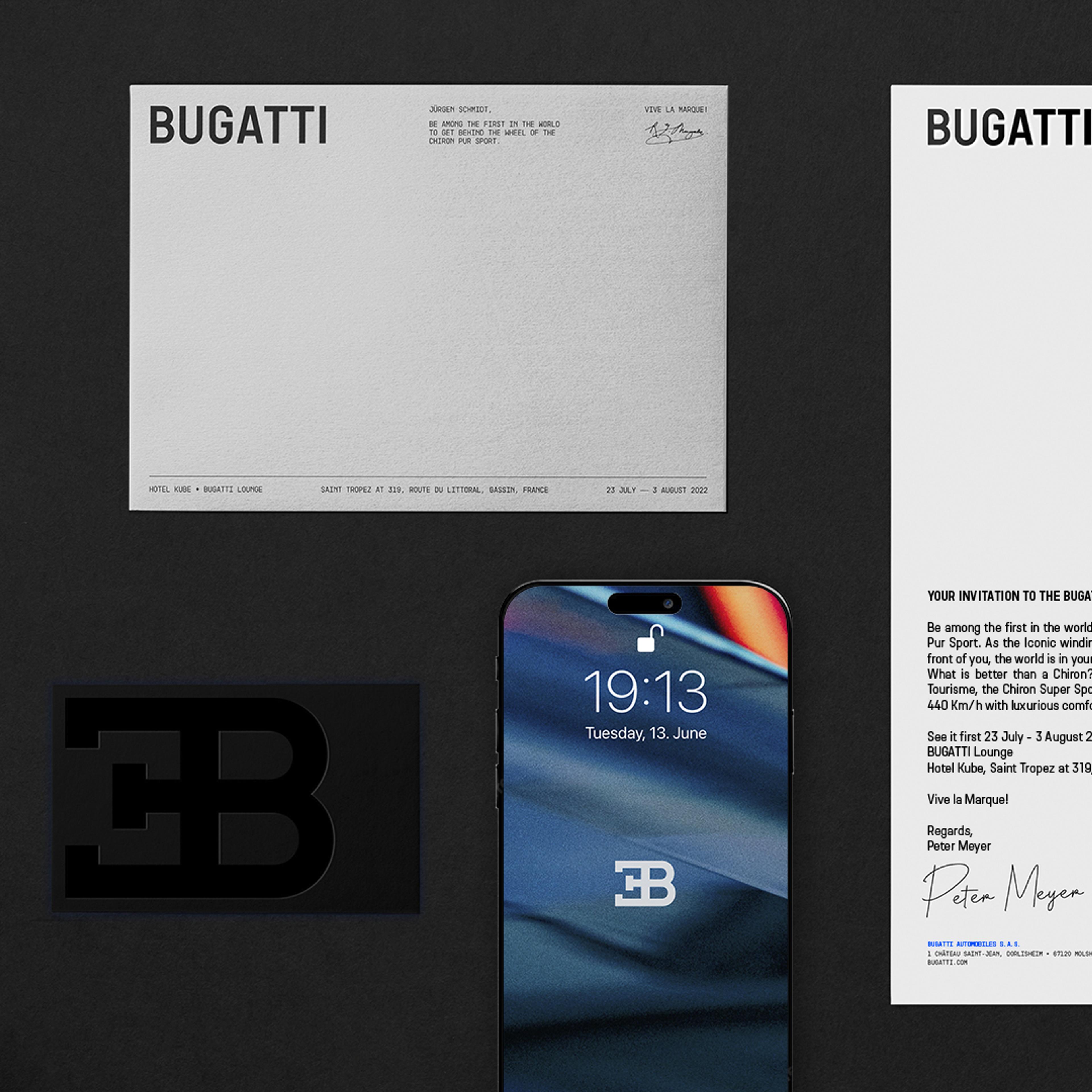 A smartphone displays a Bugatti logo on its screen, showing the time 19:13, with the date Tuesday, June 13. The phone is centrally positioned between invitation cards printed with the Bugatti brand name, a signature, and event location information. One card has a black Bugatti emblem on it.