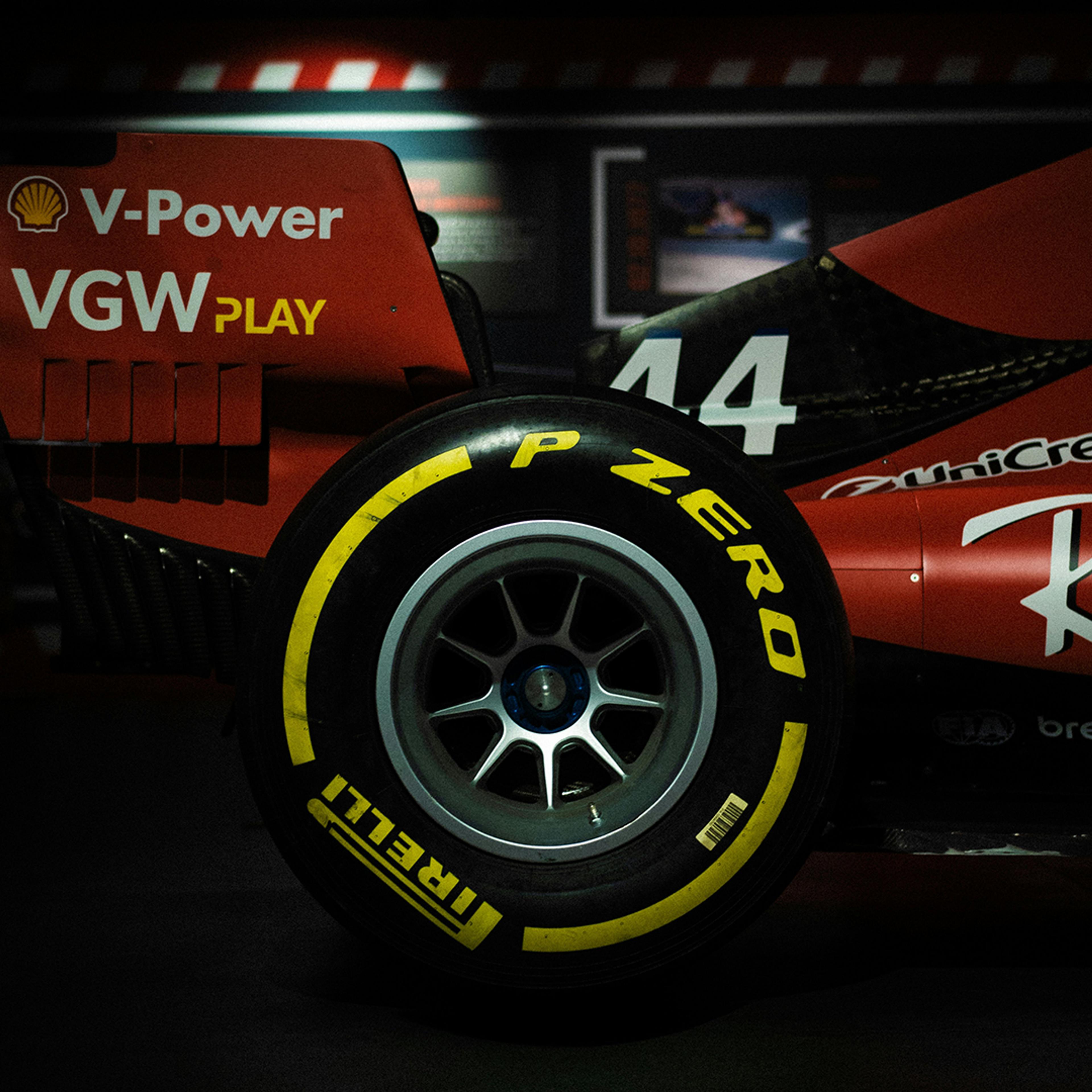 Close-up of a Formula 1 car’s rear wheel with Pirelli P Zero tire, showing sponsor logos and the number 44 on the vehicle’s body.